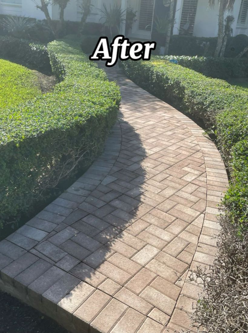 After: the same walkway, pavers back to their original tan and red
